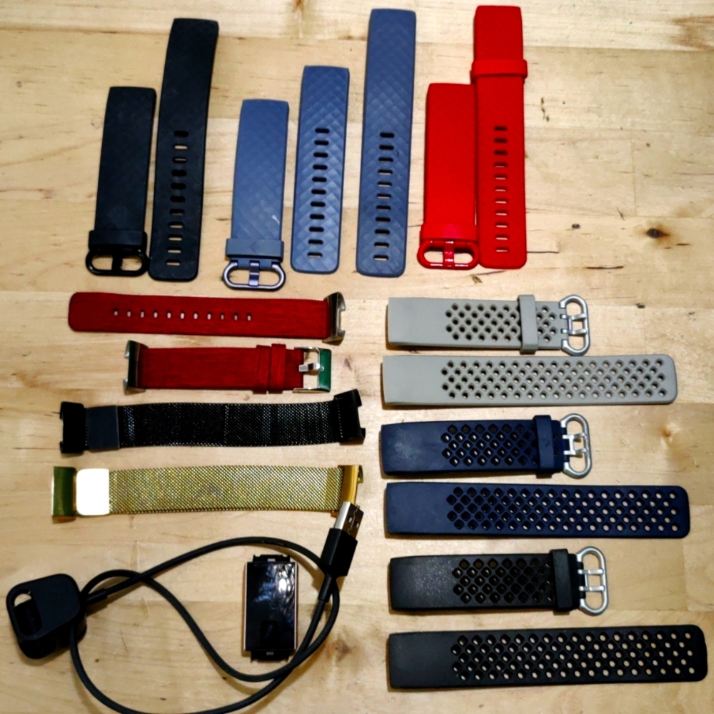 FitBit Charge 3 in rose gold with charger and bands